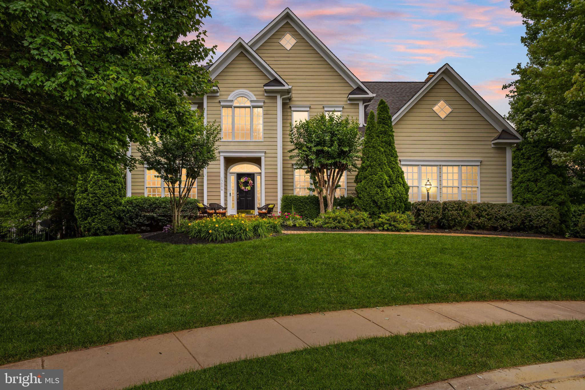 Charming home with lush landscaping.
