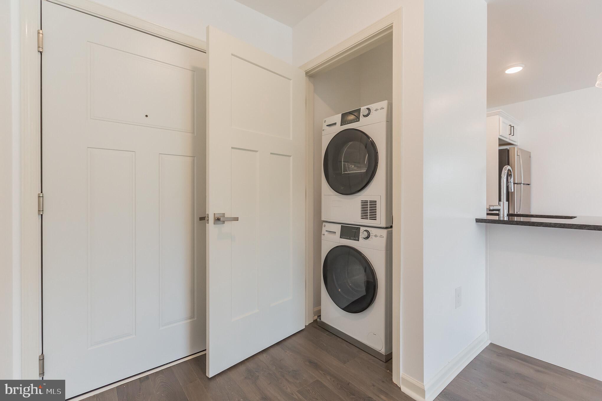 6778 Ridge Avenue, Unit 201 Philadelphia, PA 19128 - Photo 14 of 15 a view of a hallway with washer and dryer