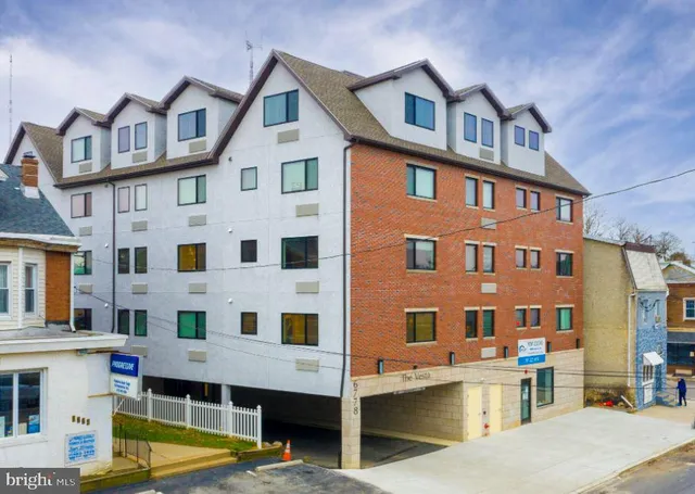 a view of a building with a swimming pool