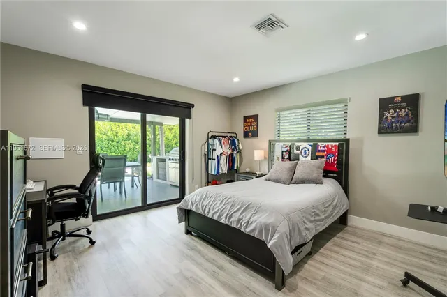 a bedroom with a bed and a dresser