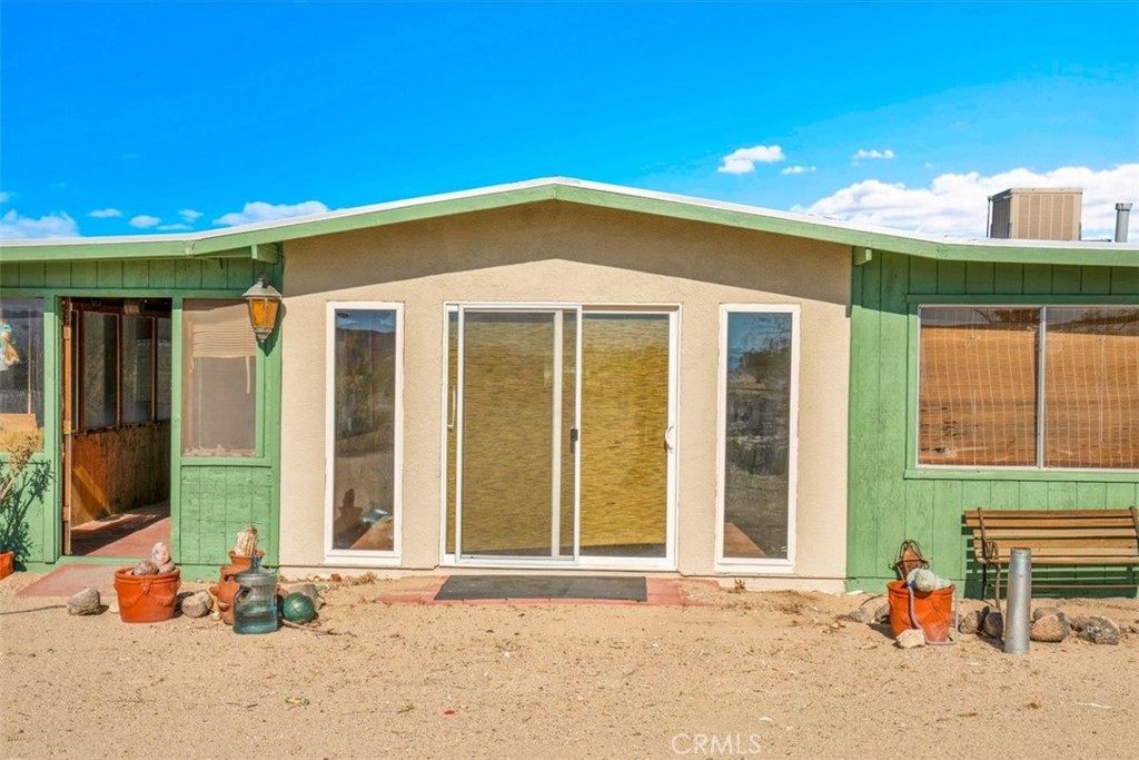 64720 Sonora Road Joshua Tree, CA 92252 - Photo 4 of 33 a front view of a house with a outdoor space