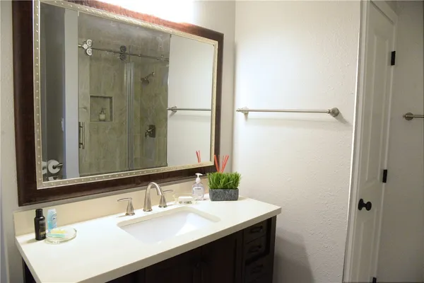 a bathroom with a sink and a mirror