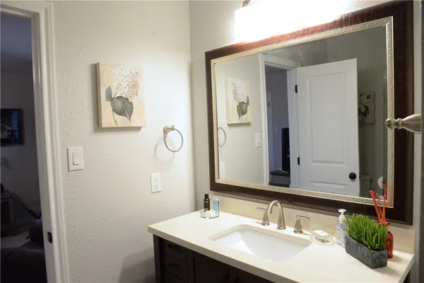 a bathroom with a sink and a mirror