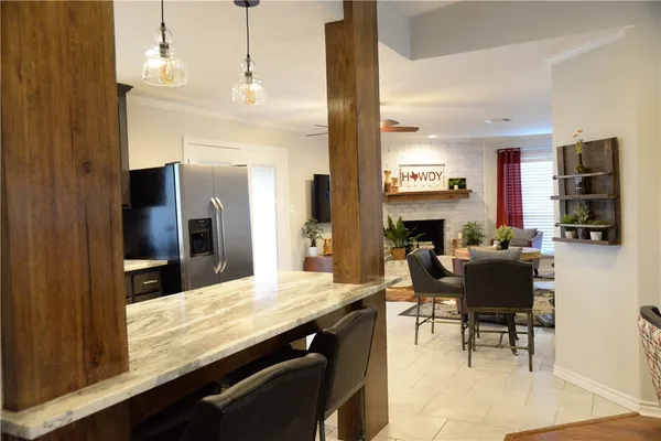 a living room with fireplace furniture and a wooden floor