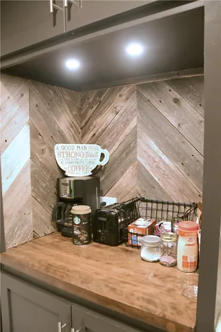 a view of a room with furniture and a chandelier