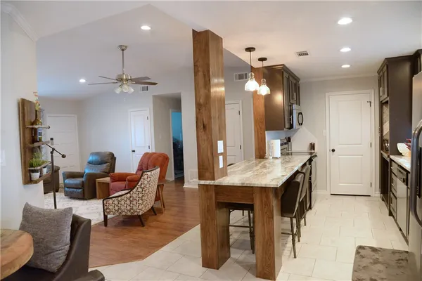 a dining room with furniture and a large mirror
