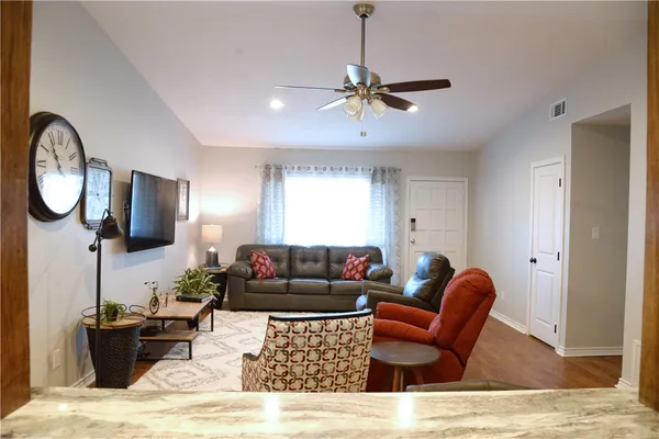 a living room with furniture and a window