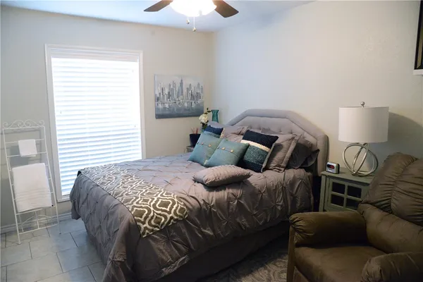 a bedroom with a bed and window