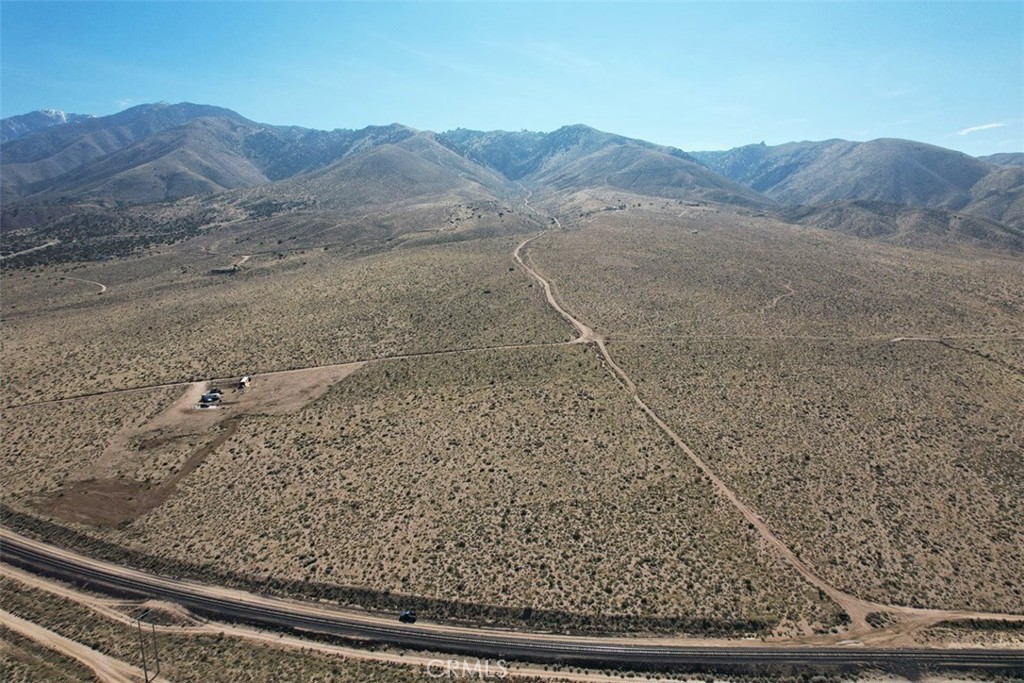 39 Santa Rosa Road Lucerne Valley, CA 92356 - Photo 14 of 18 a view of a dry field with mountains in the background