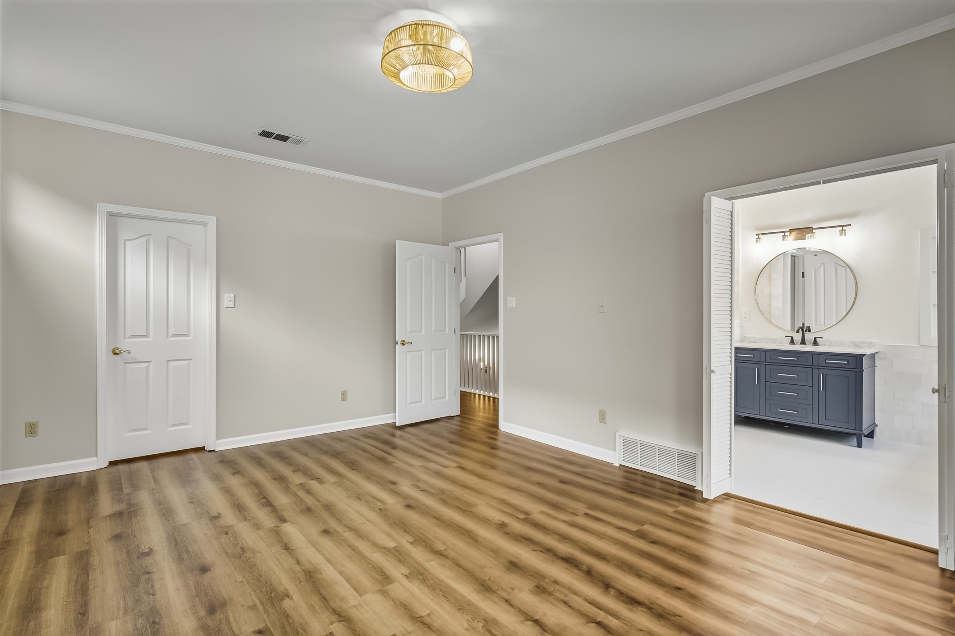 154 Harbor Ridge Lane North Memphis, TN 38103 - Photo 21 of 39 a view of a room with wooden floor and a bathroom