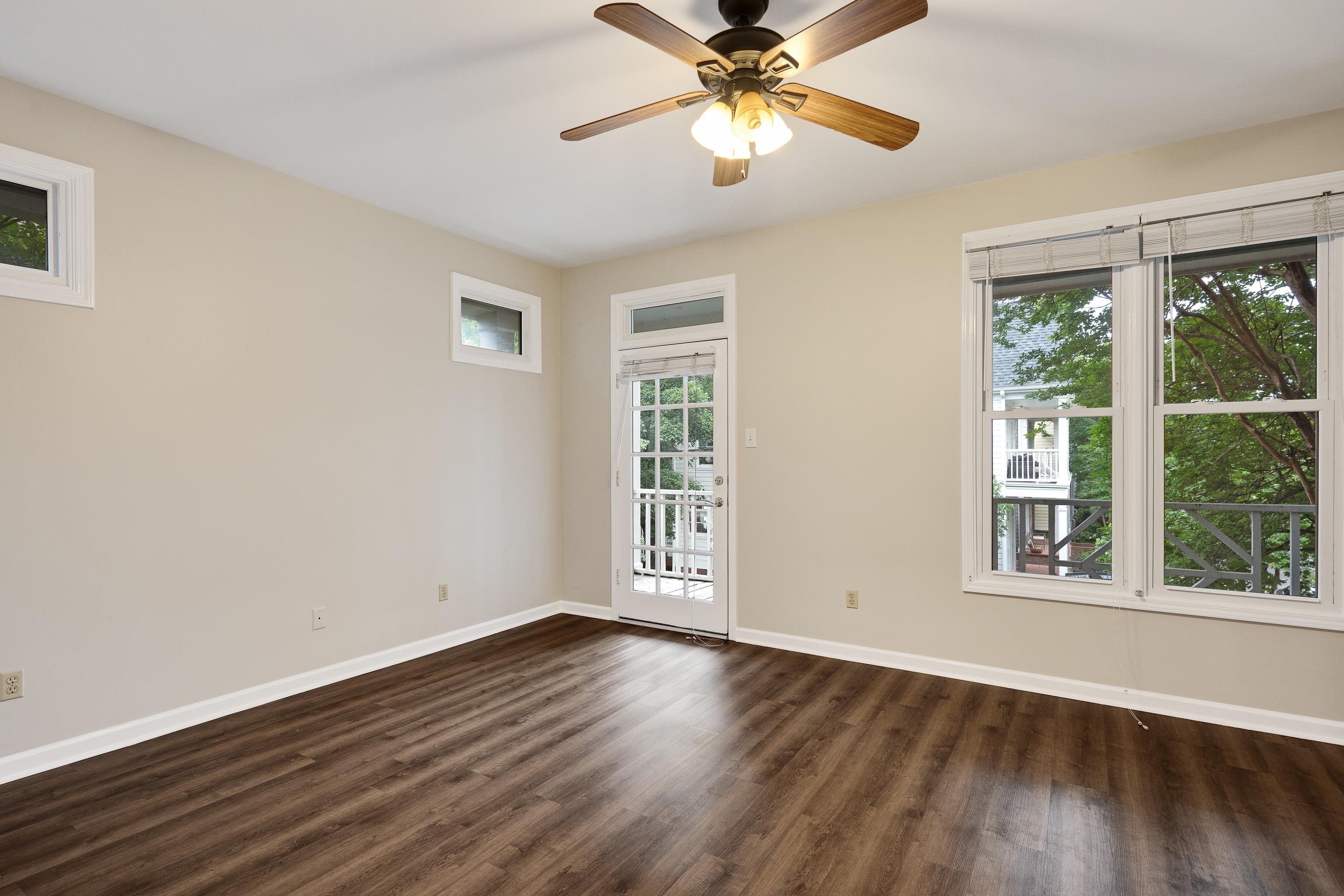 154 Harbor Ridge Lane North Memphis, TN 38103 - Photo 27 of 39 a view of an empty room with wooden floor and a window