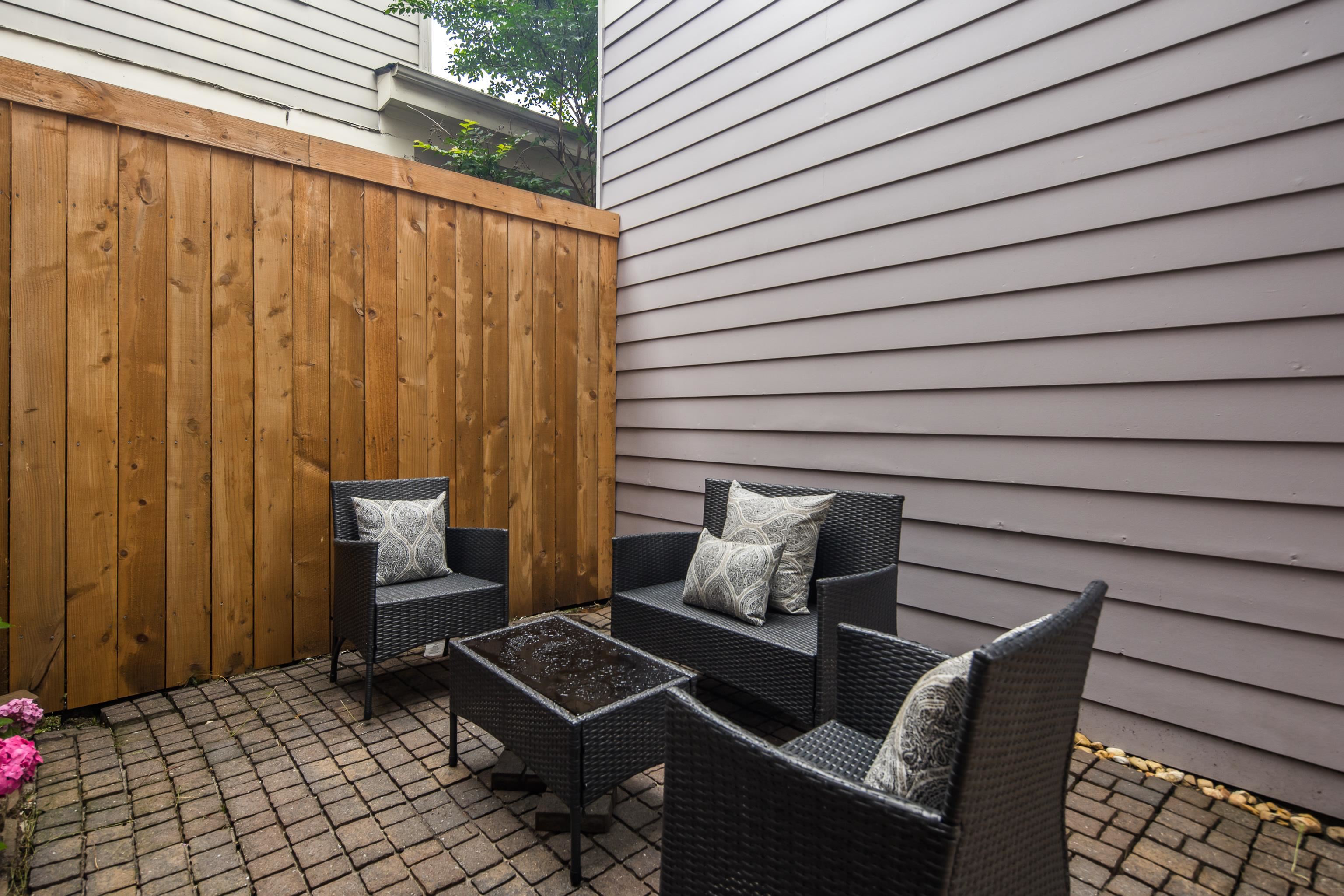 154 Harbor Ridge Lane North Memphis, TN 38103 - Photo 36 of 39 a balcony with wooden floor and outdoor seating