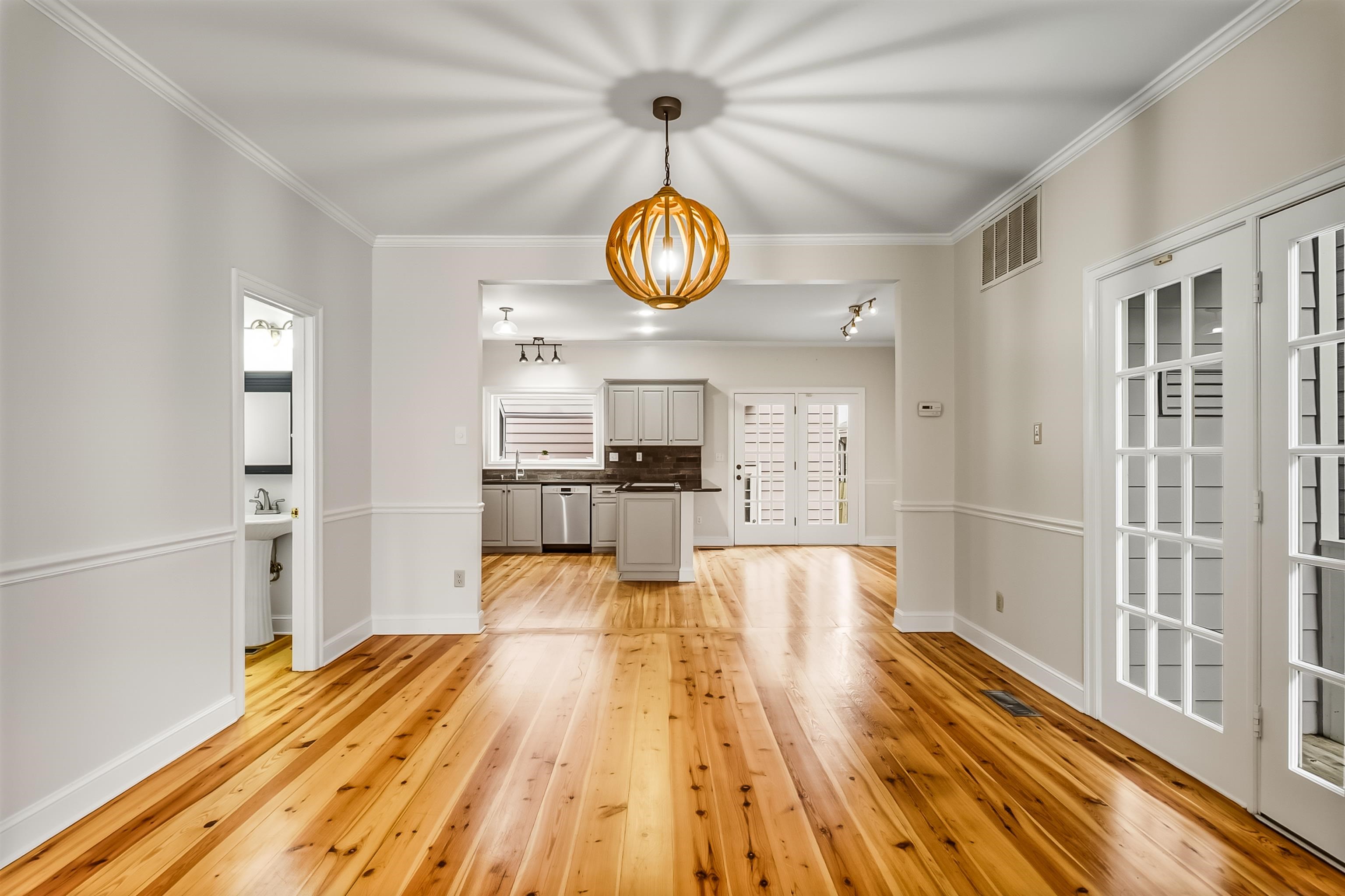 154 Harbor Ridge Lane North Memphis, TN 38103 - Photo 10 of 39 a view of a kitchen with wooden floor and windows
