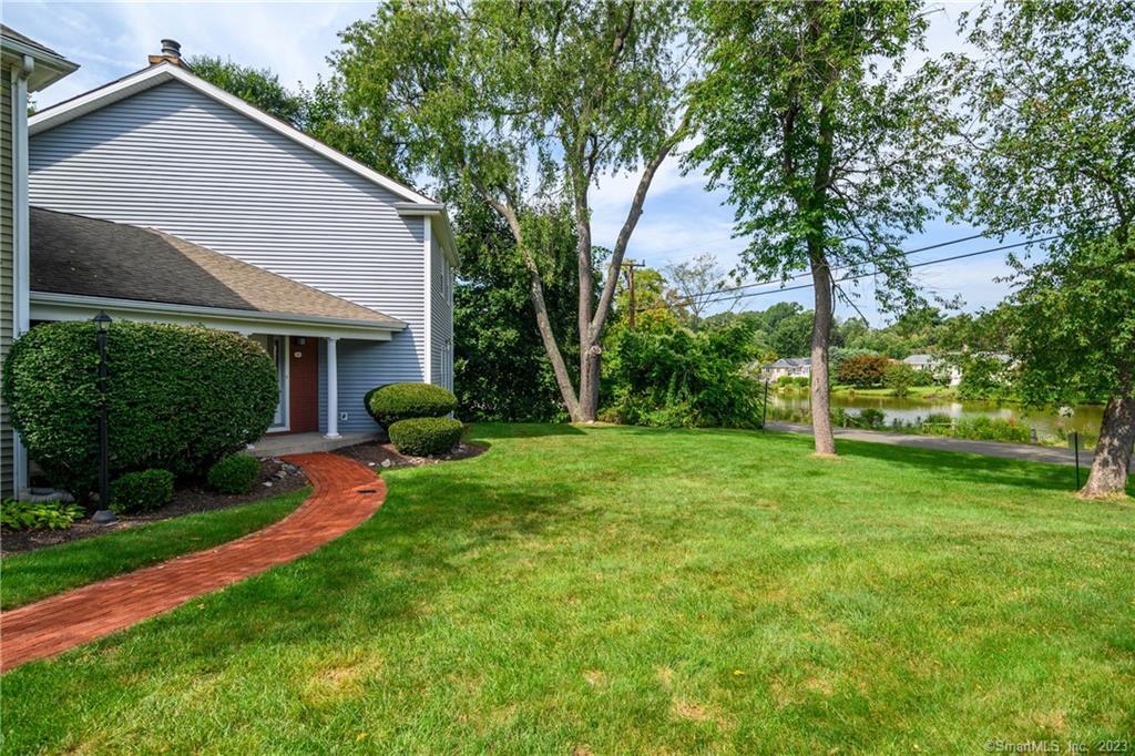 1 East Hayestown Road, Unit 48 Danbury, CT 06811 - Photo 1 of 1 a view of a house with backyard and a tree