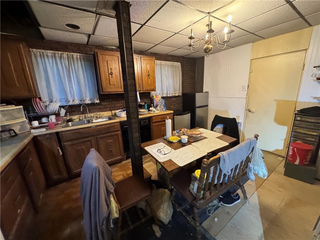 233 Alries Street Pittsburgh, PA 15210 - Photo 6 of 16 a view of a dining room with furniture window and wooden floor