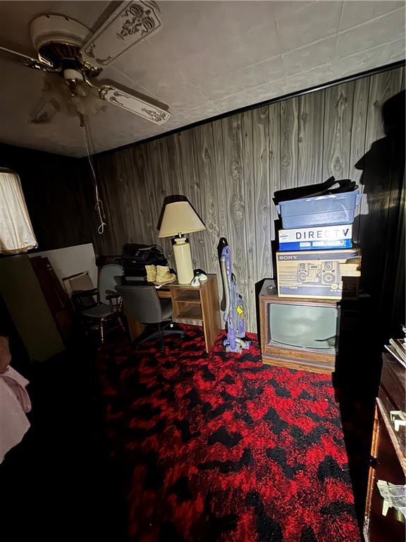233 Alries Street Pittsburgh, PA 15210 - Photo 8 of 16 a living room with a couch and a stove