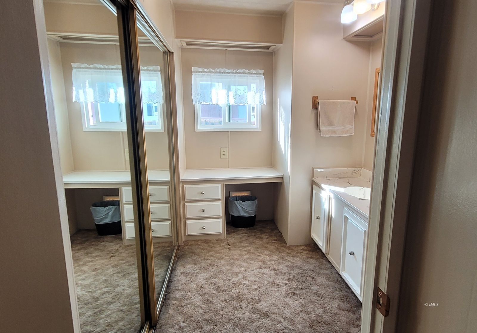 2293 Galloway Avenue Bishop, CA 93514 - Photo 11 of 13 a view of a hallway and a livingroom with furniture