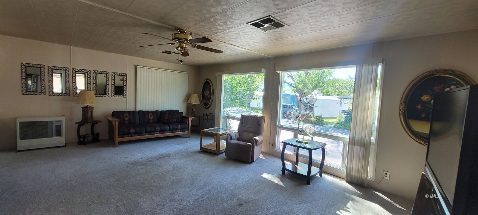 2293 Galloway Avenue Bishop, CA 93514 - Photo 3 of 13 a living room with furniture and a floor to ceiling window