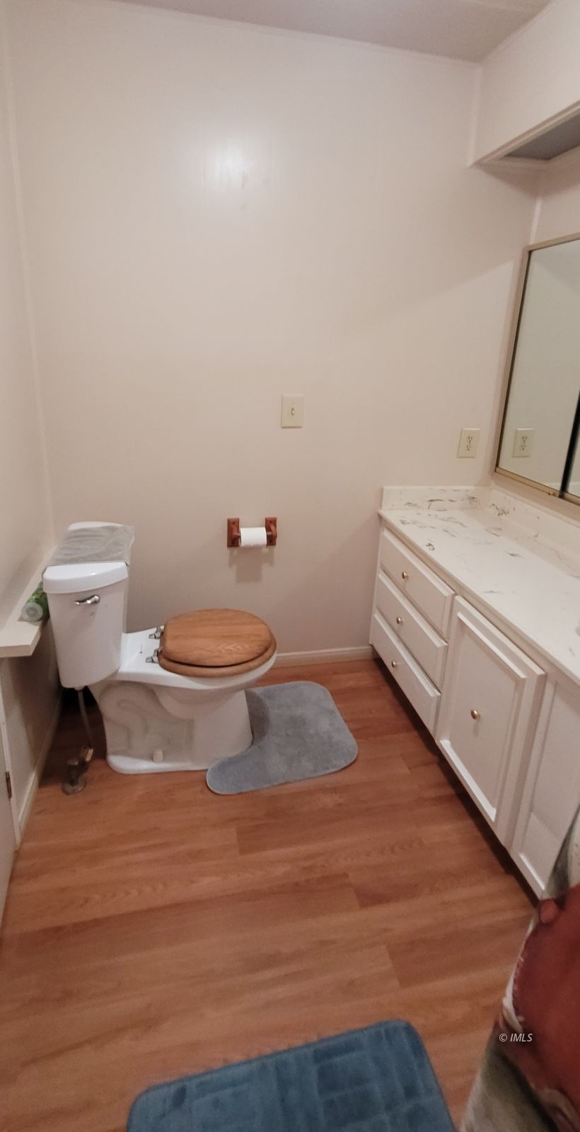 2293 Galloway Avenue Bishop, CA 93514 - Photo 9 of 13 a bathroom with a toilet and a mirror