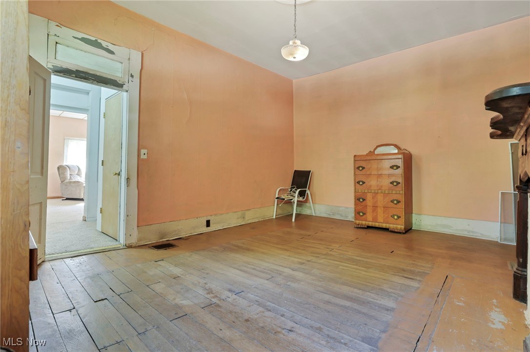 21372 Bridgewater Road Quaker City, OH 43773 - Photo 19 of 39 Spare room featuring hardwood / wood-style floors