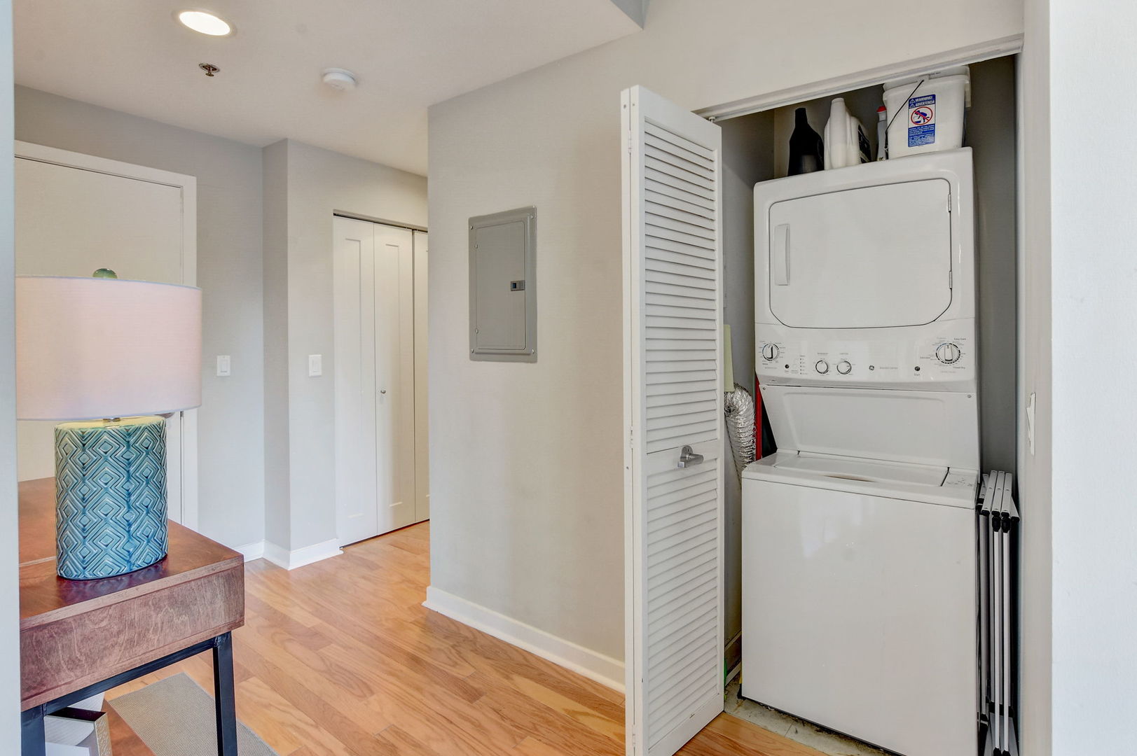 909 West Washington Boulevard, Unit 704 Chicago, IL 60607 - Photo 19 of 36 a view of washer and dryer with wooden floor
