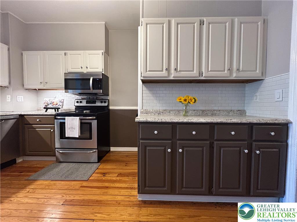 45 Evergreen Street Nazareth, PA 18064 - Photo 14 of 35 a kitchen with stainless steel appliances granite countertop a stove and a sink