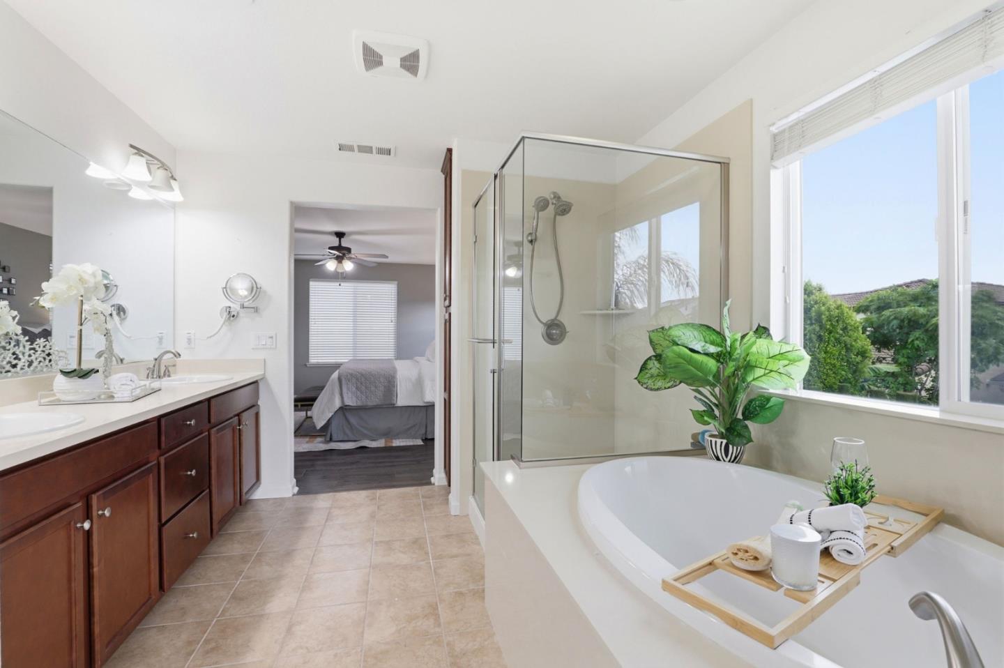 301 Promise Way Hollister, CA 95023 - Photo 8 of 22 a spacious bathroom with a tub shower and sink