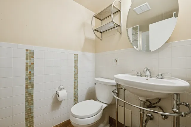 a bathroom with a shower and a sink