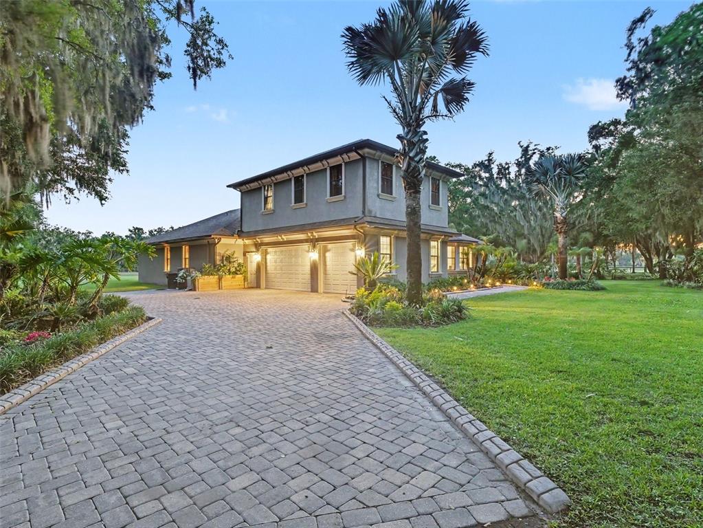 339 Corbett Road Lithia, FL 33547 - Photo 7 of 38 a front view of a house with garden