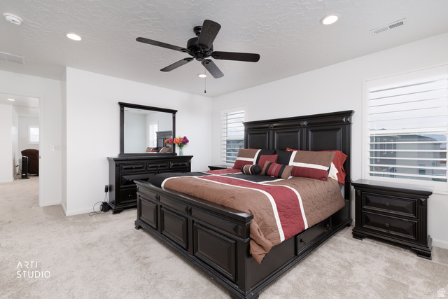 540 Lefty Lane Tooele, UT 84074 - Photo 22 of 48 Bedroom featuring light carpet, a ceiling fan, and recessed lighting
