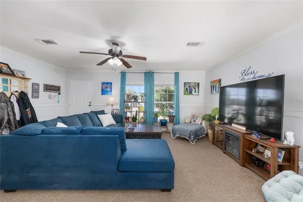 a bedroom with furniture and a chandelier