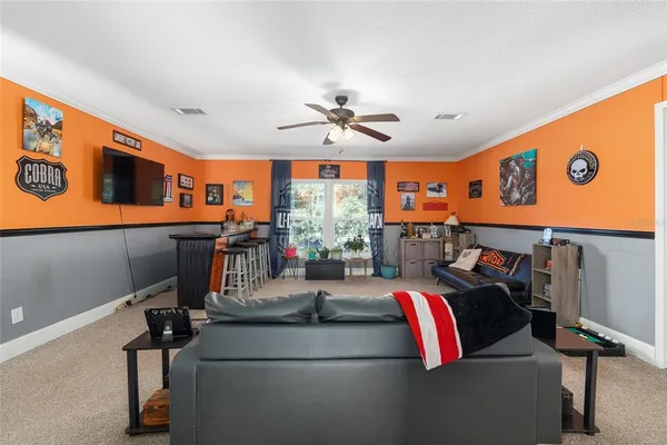 a bed room with a bed mirror and a window
