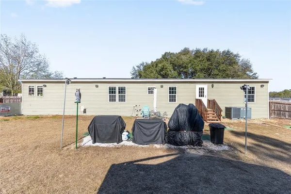 a view of a backyard with trees