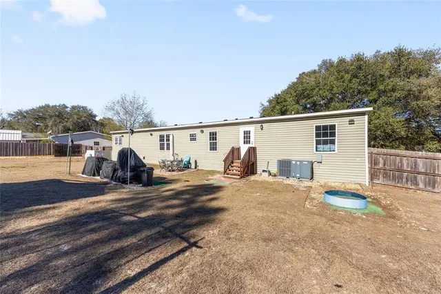 an aerial view of residential house with outdoor space