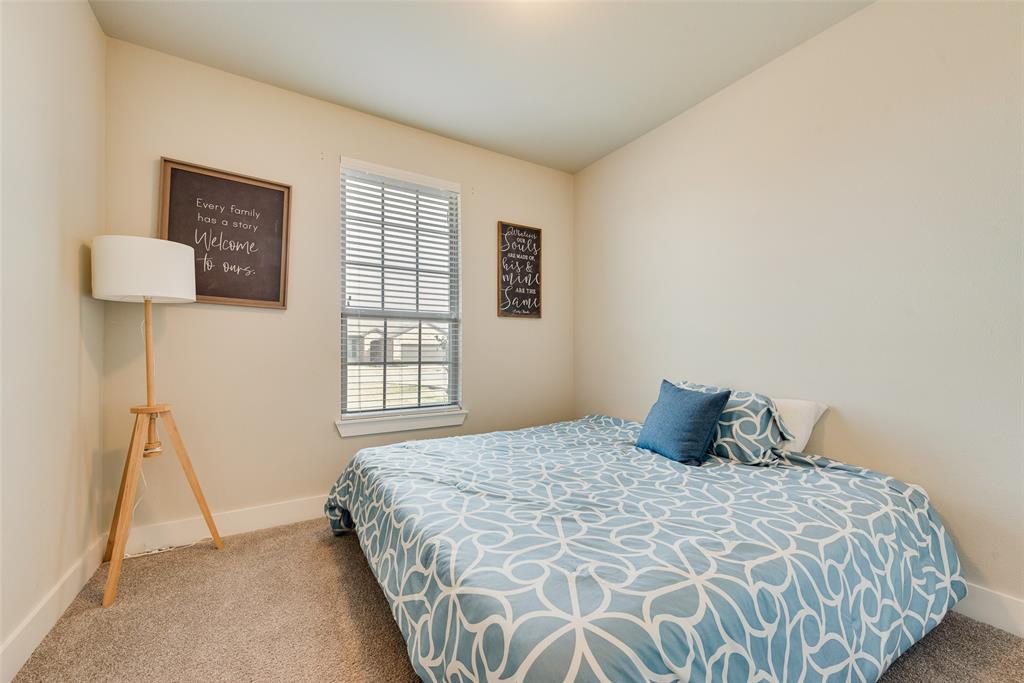 480 Collin Street Nevada, TX 75173 - Photo 15 of 27 a bedroom with a bed and a window