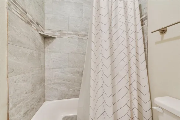 a bathroom with a shower curtain