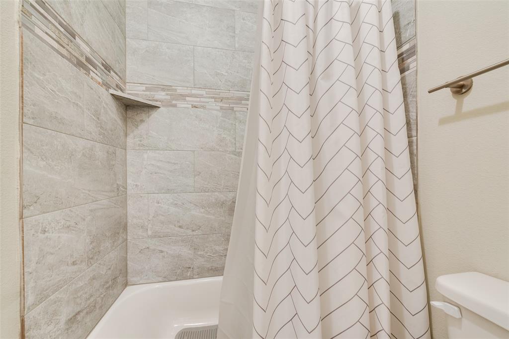 480 Collin Street Nevada, TX 75173 - Photo 17 of 27 a bathroom with a shower curtain
