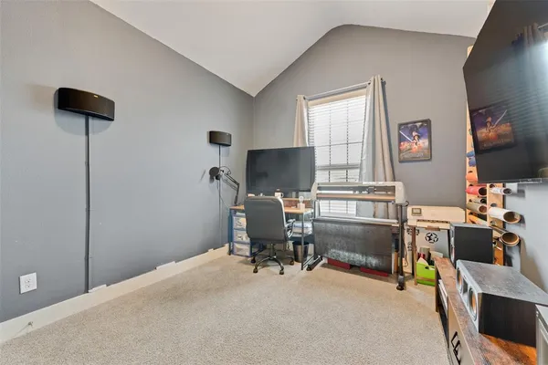 a workspace with furniture and a window