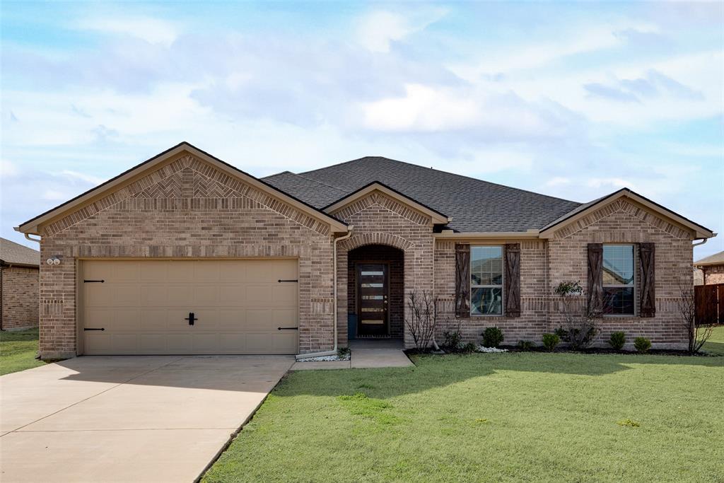 480 Collin Street Nevada, TX 75173 - Photo 2 of 27 a view of a house with garden