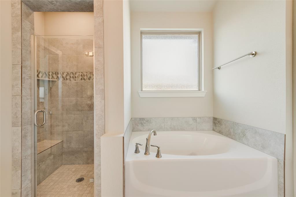 480 Collin Street Nevada, TX 75173 - Photo 23 of 27 a bath tub sitting next to a shower