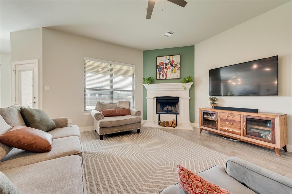 480 Collin Street Nevada, TX 75173 - Photo 5 of 27 a living room with furniture and a flat screen tv