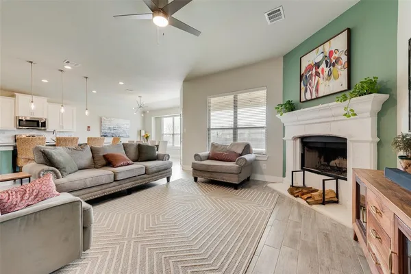 a living room with furniture and a fireplace