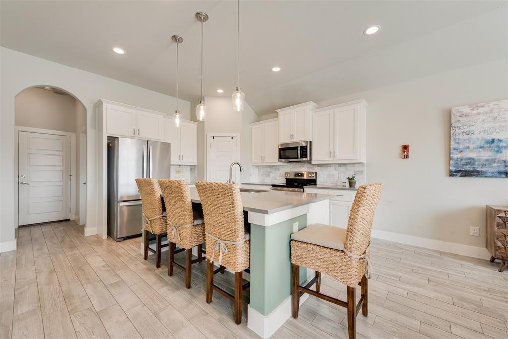 480 Collin Street Nevada, TX 75173 - Photo 10 of 27 a view of a dining room with furniture and wooden floor
