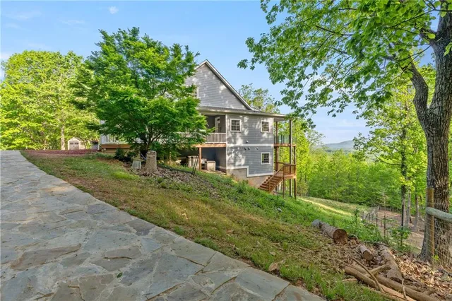 a aerial view of a house with a yard table and chair