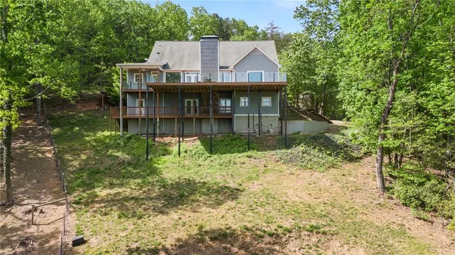 an aerial view of a house with yard and outdoor space