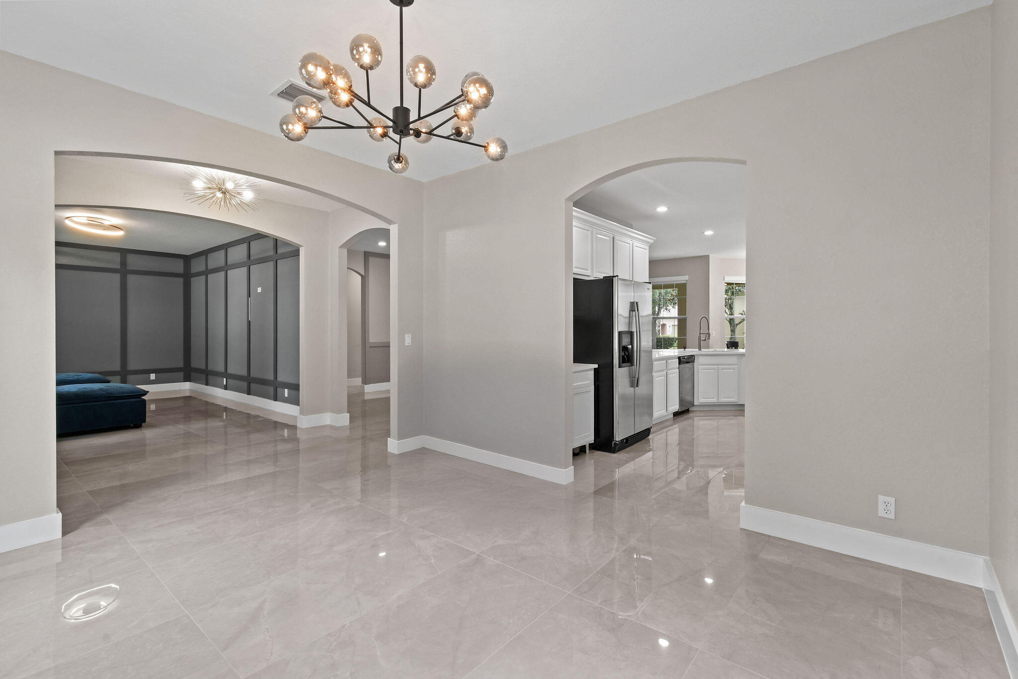 111 Tullamore Avenue Jupiter, FL 33458 - Photo 11 of 63 a view of a hallway with wooden floor