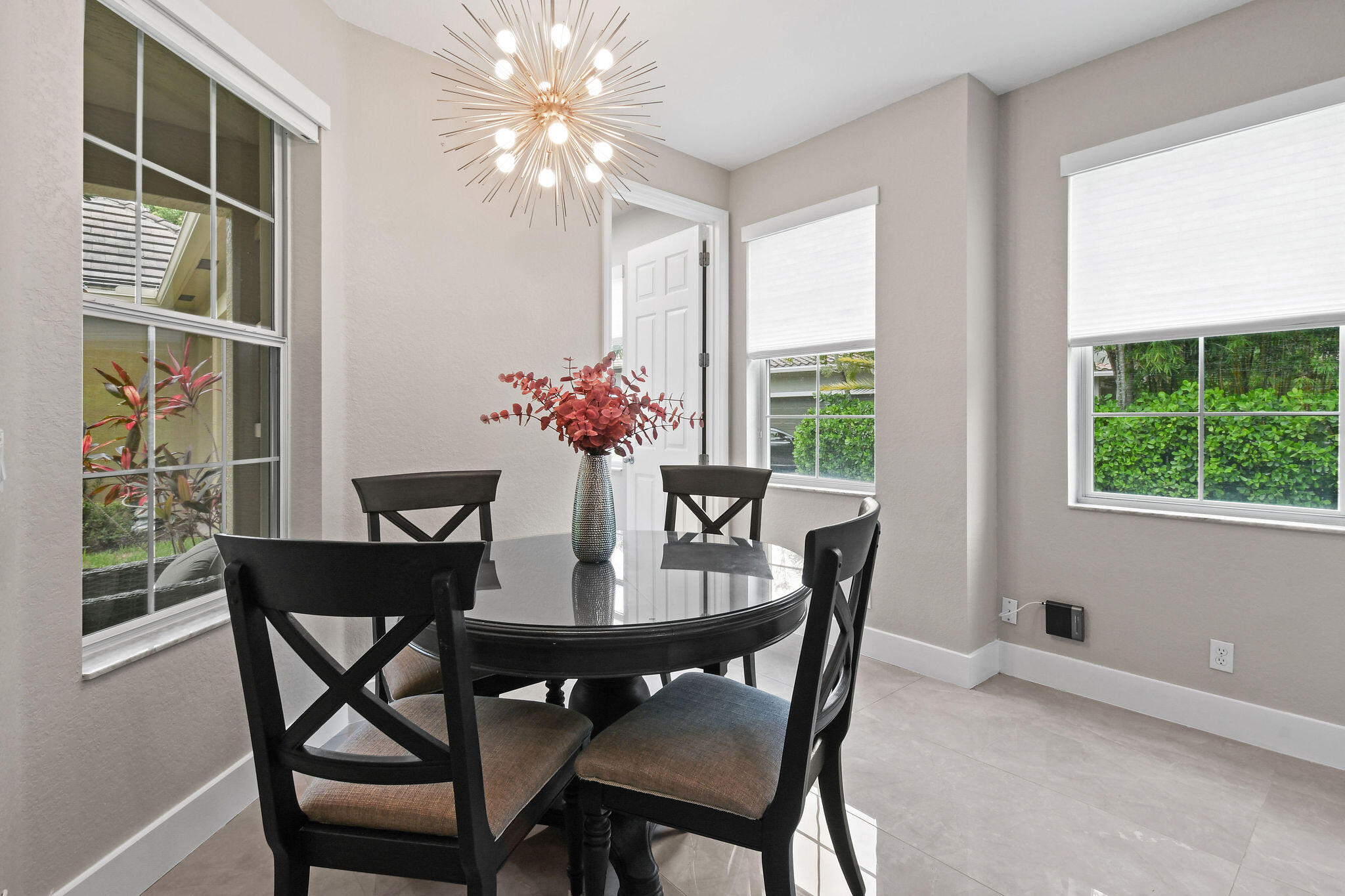 111 Tullamore Avenue Jupiter, FL 33458 - Photo 22 of 63 a dining room with furniture and window