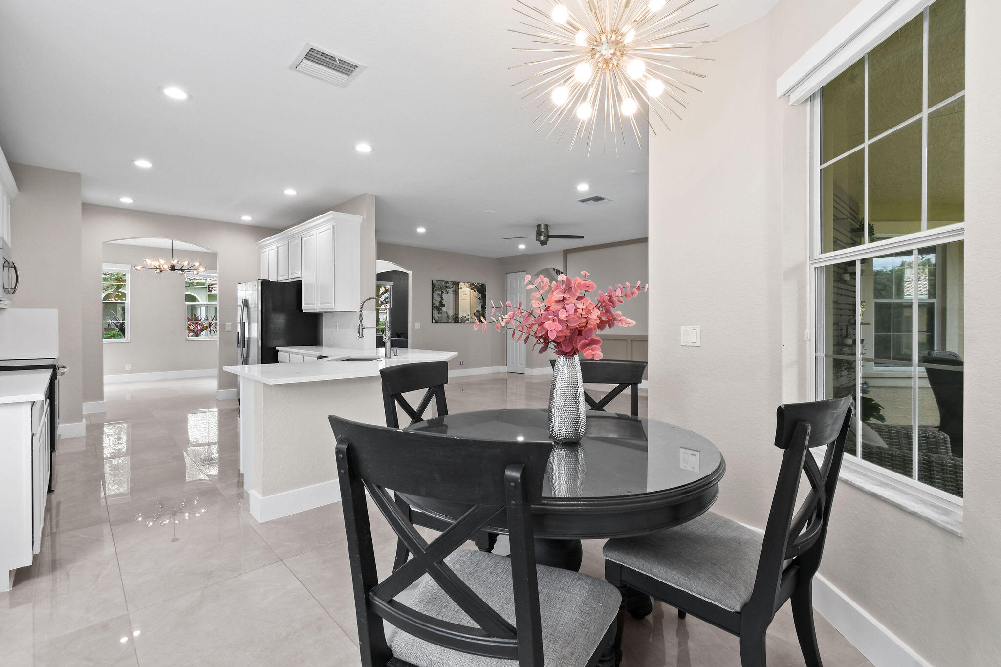 111 Tullamore Avenue Jupiter, FL 33458 - Photo 23 of 63 a dining room with furniture and window