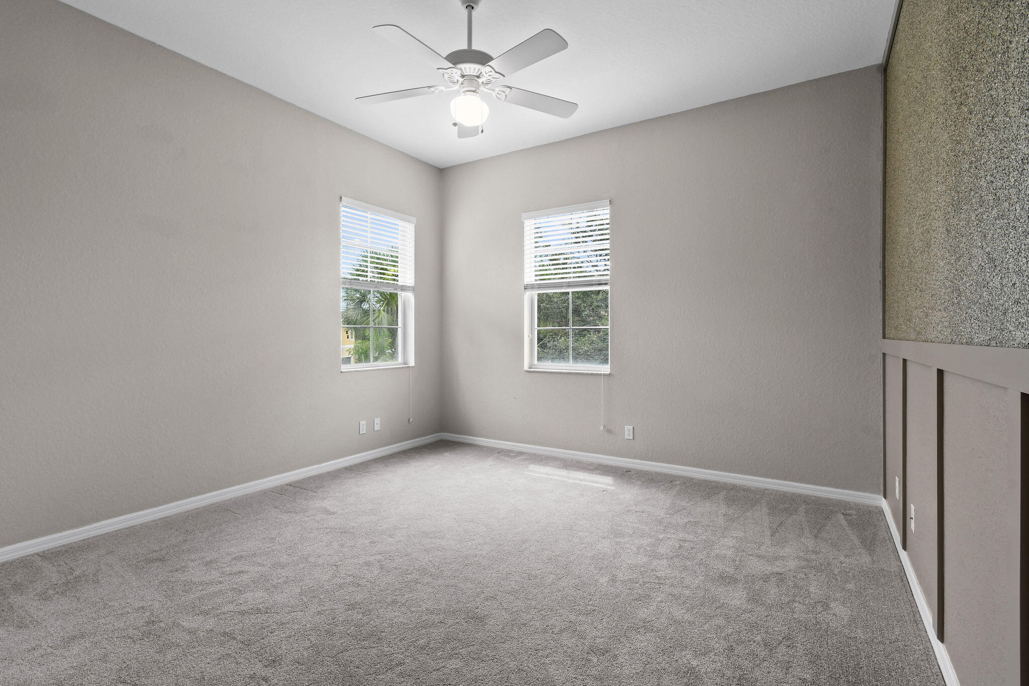 111 Tullamore Avenue Jupiter, FL 33458 - Photo 31 of 63 an empty room with windows and fan