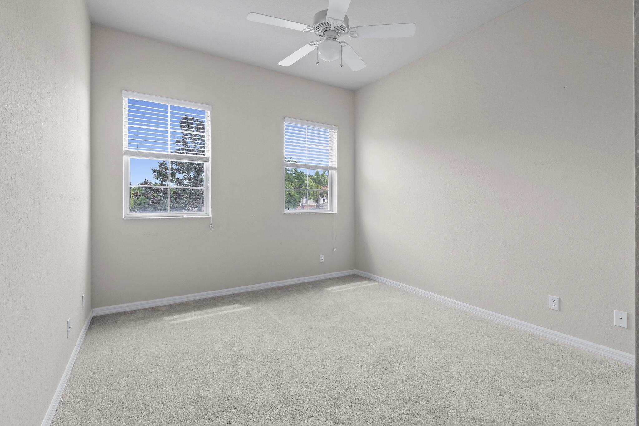 111 Tullamore Avenue Jupiter, FL 33458 - Photo 33 of 63 an empty room with windows and fan
